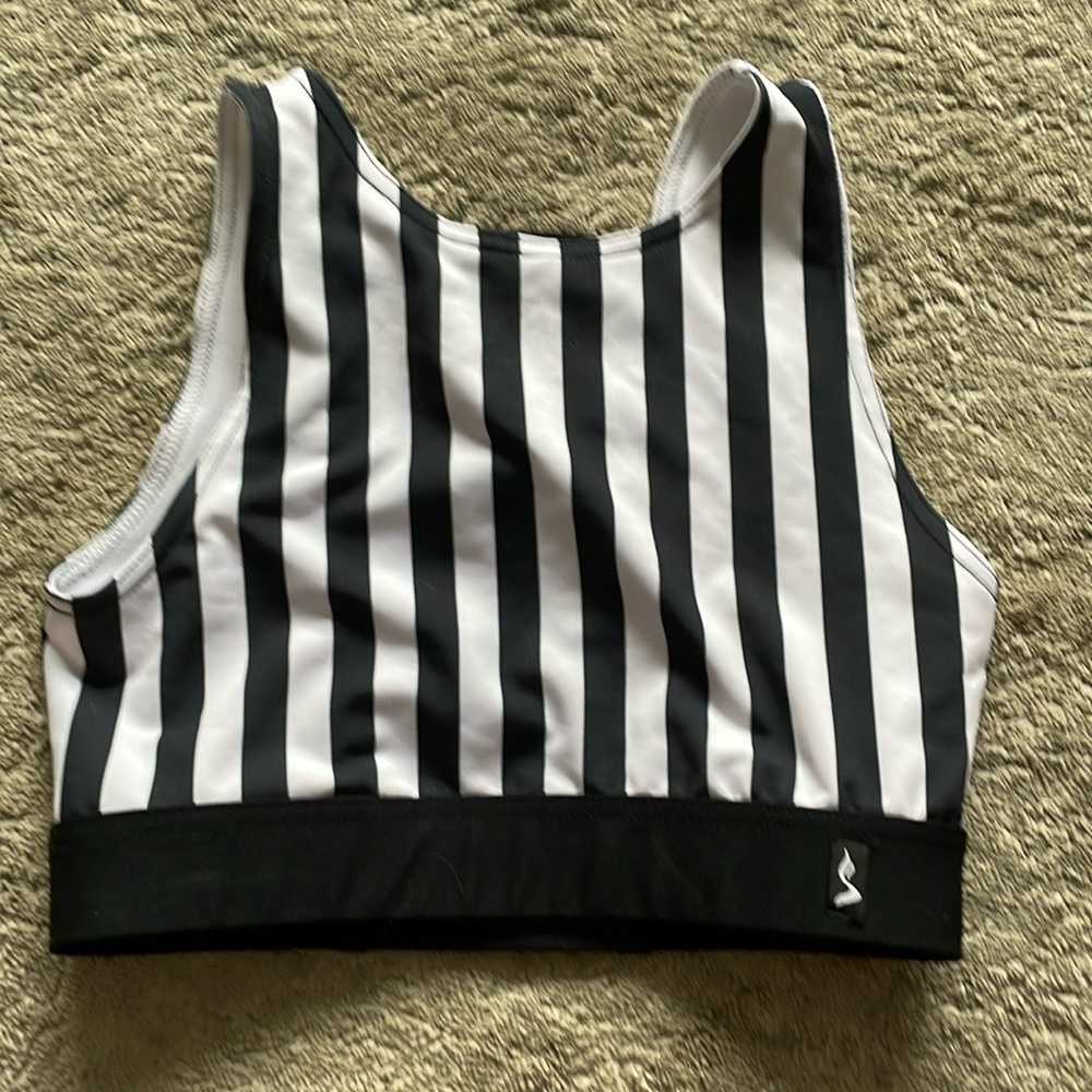Sway reversable pole top